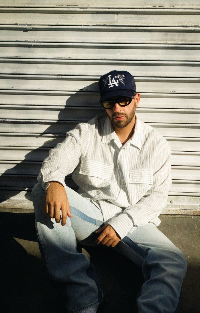 BFTL button-down shirt, stylist’s own; Sworn 2 Us baseball cap, sworntous.com PHOTOGRAPHED BY DEATHTOGIAN STYLED BY MARIO RANGEL