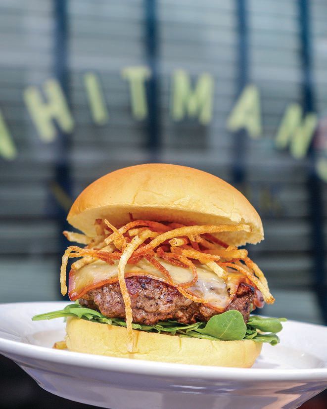 Enjoy a selection of decadent burgers and handhelds PHOTO COURTESY OF WHITMANS MIAMI